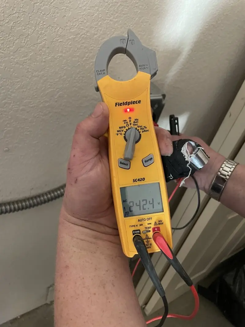 Voltage testing with clamp meter during Electrical Installation Services in Huntington Beach